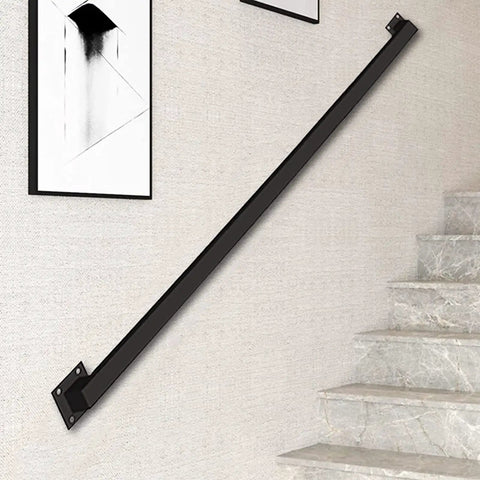 Industrial Stair Railing Kit Featuring Heavy Duty Galvanized Iron Pipe Handrail mounted on wall, ideal for indoor stairways.