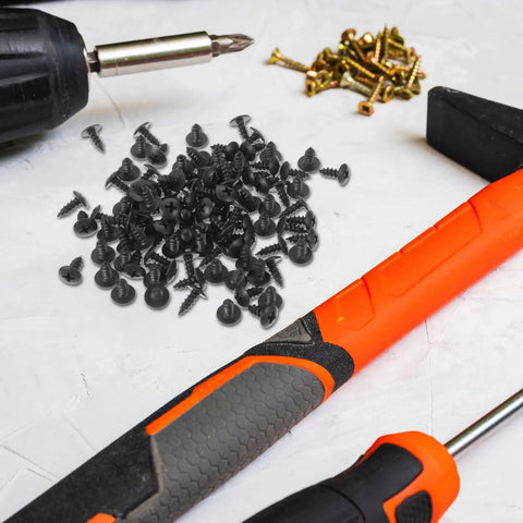 Hardcore Carbon Steel Mini Wood Screws Deep Thread Fasteners Furniture Hardware Kit No Sweat Assembly Tough Little Bolts For Home Repair Heavy Duty Small Screw Replacement Kit 100 Pack scattered on a work surface with tools.