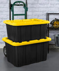 Heavy Hitter Heavy Duty Storage Totes With Secure Lids For Garage, 27 Gallon Stackable Plastic Bins 8 Pack on a cart.