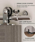 Close-up of Beefed Up Stainless Steel Sliding Track Barn Door Hardware Kit For Double Doors Heavy Duty 13 Ft Long Track 220 Lb Capacity Smooth Quiet Rollers Anti Rust Corrosion Resistant System showing roller and stopper features.