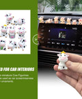 8-piece cow car dashboard ornament set; white plastic cow figurines for car interior, shown on dashboard and in hand