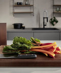 10 Inch Diamond Sharpening Steel For Knife Maintenance, Pro Grade Honing Rod next to cutting board with vegetables and knife
