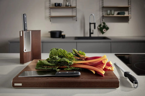 10 Inch Diamond Sharpening Steel For Knife Maintenance, Pro Grade Honing Rod next to cutting board with vegetables and knife