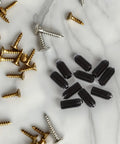 Heavy Duty Carbon Steel Spring Ball Plunger Set Hex Positioning Screws on a marble surface, featuring various screws.