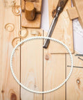 Four Pack Heavy Duty Rubber Replacement Belts For Sealing Machines Featuring Precise Tooth Design and quiet rubber belt on wooden workbench.