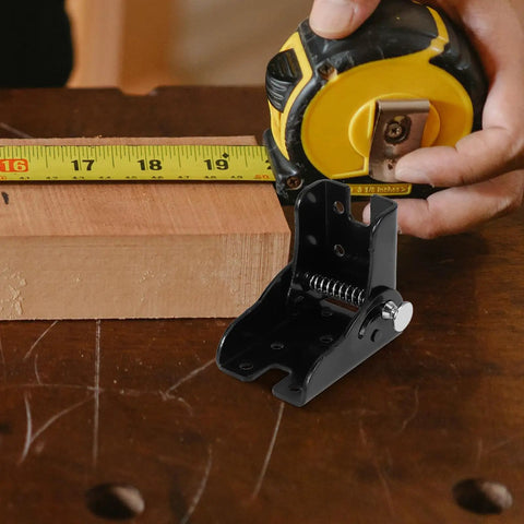 Folding Hinges For Furniture 90 Degree Self Locking Heavy Duty Brackets next to measuring tape on wood surface