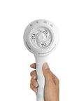 Hand holding Sm451E 1.8 GPM PowerSpray Plus Shower Massage Head Upgrade With Handheld Hose And Adjustable Bracket Four Spray Settings White