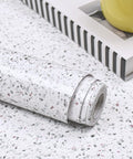 White Glossy Marble Contact Paper Self Adhesive Peel and Stick Wallpaper for Countertops Kitchen Bathroom Cabinets Waterproof and Easy to Clean 118 In by 15.7 In Roll 12.9 Sq Ft with Grid Back for Quick Measuring and Cutting, rolled on speckled surface