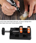 Heavy Duty Aluminum Alloy Milling Vise With Fixed Curve Grooves securing a carving piece with a drill.
