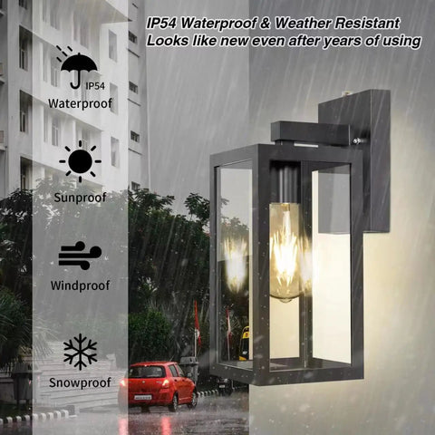 Two Pack Dusk To Dawn Outdoor Wall Lanterns With Sensor Matte Black Exterior Porch Lights E26 Base Socket Anti Rust Waterproof Weatherproof Wall Mounts For Doorway Garage Hallway Patio And Garden Ambience mounted on building wall with glowing light in rain