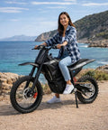 Beast 3000W Electric Dirt Bike For Teens And Adults 40 MPH Top Speed 53 Mile Range 48V 23Ah Battery 14 And 12 Inch Tires Dual Disc Brakes Full Suspension Off Road Ride, side view on coastal trail