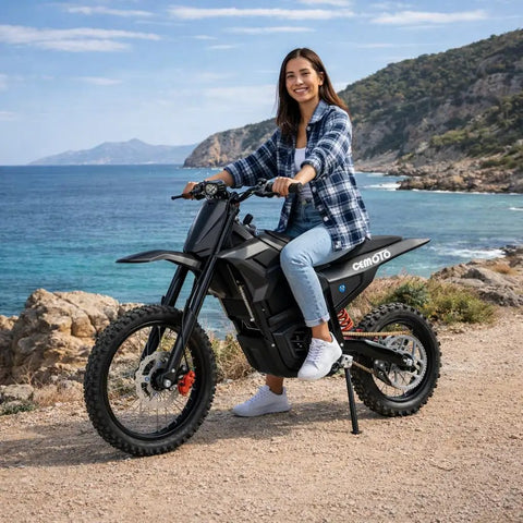 Beast 3000W Electric Dirt Bike For Teens And Adults 40 MPH Top Speed 53 Mile Range 48V 23Ah Battery 14 And 12 Inch Tires Dual Disc Brakes Full Suspension Off Road Ride, side view on coastal trail