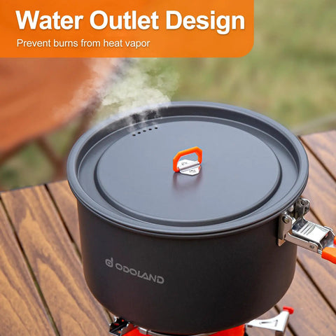 Nonstick Camping Cookware Mess Kit with pot on outdoor wooden table steaming, water outlet design feature visible