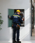 Pro Grade 24X36 Metal Wall Access Panel For Drywall paintable aluminum hatch being used by plumber for plumbing fix.