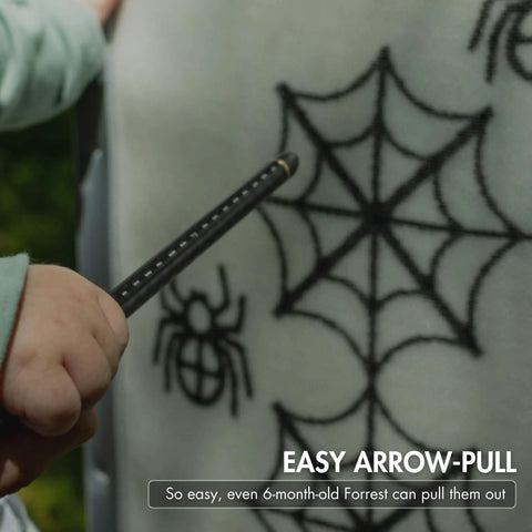 Child pulling arrow from Large Archery And Crossbow Target For 400 FPS Easy Arrow Removal Durable Spylar Facing Weatherproof Cover.