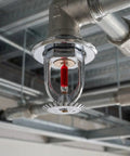 No Sweat Heavy Duty Fire Sprinkler Head 10 Pack Quick Response Activation At 155 Fahrenheit Water Spray Up One Half Inch Thread solid copper sprinkler installed on ceiling.