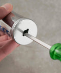Close-up of the metal end and green handle of the Mini Grease Gun Injector 80cc 3 Oz One Hand Operation with Needle Nozzle Pistol Grip