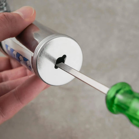 Close-up of the metal end and green handle of the Mini Grease Gun Injector 80cc 3 Oz One Hand Operation with Needle Nozzle Pistol Grip