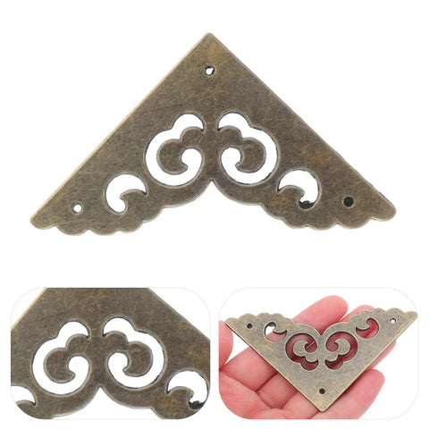 Metal Corner Protectors Set 12 Ornate Edge Guards Made Of Zinc Alloy Old School Vintage Look held in hand