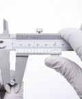 Stainless Steel Vernier Caliper 0 To 8 Inch And 200 mm With Inch Fraction And Metric Readings held by gloved hands