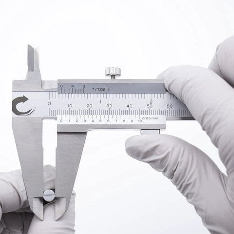 Stainless Steel Vernier Caliper 0 To 8 Inch And 200 mm With Inch Fraction And Metric Readings held by gloved hands
