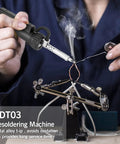 Person using Electric Desoldering Pump For PCBs And Electronics Repair 110V 30W Automatic Solder Sucker on circuit board