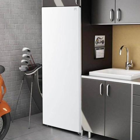 No Sweat Storage Upright Convertible Freezer Fridge With Seven Point Zero Cubic Feet Capacity In Clean White Build in a garage setting.