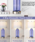 Set Of 2 Blue Glass Table Lamps 26 Inches Tall With White Shade, Touch Control And USB Ports, dimmable light levels shown