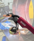 Sturdy Magnetic Mig Welding Torch Holder Stand With Strong High Carbon Steel Pliers For Cutting And Organizing Cables To Keep Your Setup Safe From Damage close-up with torch and magnetic base.