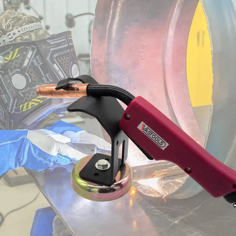 Sturdy Magnetic Mig Welding Torch Holder Stand With Strong High Carbon Steel Pliers For Cutting And Organizing Cables To Keep Your Setup Safe From Damage close-up with torch and magnetic base.