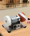 Heavy Duty Mini Belt Sander, Kickass Electric Benchtop Grinder With Dual Coarse And Fine Wheels, Fast Variable Speed Control in action sharpening a knife.