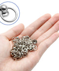 Rock Solid 60 Pack 8mm Screwback Round Head Rivets With Compact Install Screwdriver Tough As Nails Zinc Alloy Silver Fasteners That Lock Down Tight For Garage Grind And Craft Jobs Bang For Your Buck, hand holding shiny silver round head rivets.
