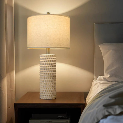24 Inch Farmhouse Ceramic Table Lamp Set Of 2 White For Bedroom And Living Room Modern Nightstand Lamps, lit beside bed.