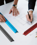 Architects using 12 Inch Triangular Architect Scale Ruler For Drafting And Blueprints Aluminum Alloy Pro Grade Tool With Six Scales on plans