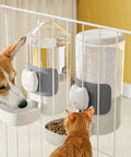 No Fuss Slick Hanging Automatic Small Pet Food Water Dispenser For Cages With Anti Spill Base That Stays Secure And Ready To Roll For Birds Or Bunnies In Gray With Adjustable Hook And Easy Clean Design For Daily Use with dog and cat interacting.