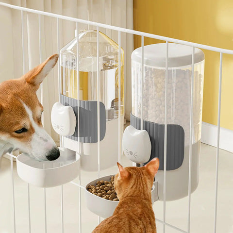 No Fuss Slick Hanging Automatic Small Pet Food Water Dispenser For Cages With Anti Spill Base That Stays Secure And Ready To Roll For Birds Or Bunnies In Gray With Adjustable Hook And Easy Clean Design For Daily Use with dog and cat interacting.