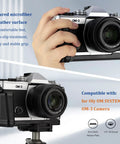OM System OM 3 Hand Grip Camera Bracket with Arca Swiss Interface on OM-3 camera, showing microfiber leather texture and grip