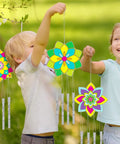 Children holding finished Lotus Flower Wind Chime Craft Kit For Kids 24 Piece Color Your Own Mandala Windchime DIY Unfinished Wood Hanging Ornaments Coloring Wind Chime Set With Paints Brushes And 39Inch Wire For Spring Summer Gifts And Parties.