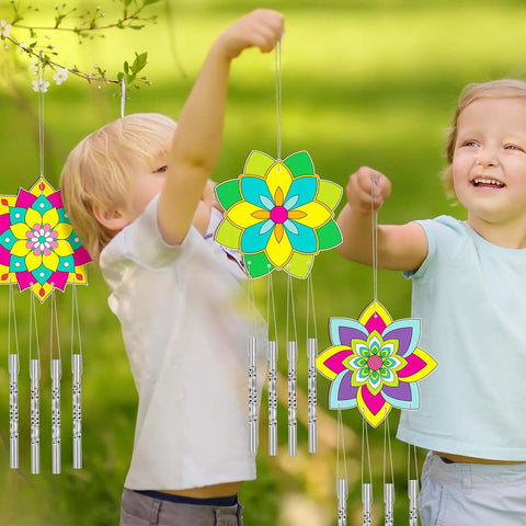 Children holding finished Lotus Flower Wind Chime Craft Kit For Kids 24 Piece Color Your Own Mandala Windchime DIY Unfinished Wood Hanging Ornaments Coloring Wind Chime Set With Paints Brushes And 39Inch Wire For Spring Summer Gifts And Parties.