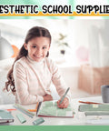 Child using green Back To School Stationery Kit With 38 Piece Aesthetic School Supplies Set for note taking.