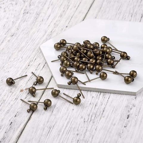 Antique Bronze Round Ball Post Stud Earrings Kit, 100 Pcs Brass Ear Pins With 1mm Loop For Jewelry Making, Vintage Style DIY Jewelry Supplies, 14.5mm Length, 12mm Width, 1.2mm Hole, brass ear pins on white board