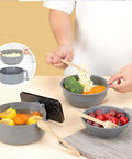 Person using Microwave Ramen Cooker Bowl With Chopsticks And Spoon, Dishwasher Safe And BPA Free, serving ramen with veggies