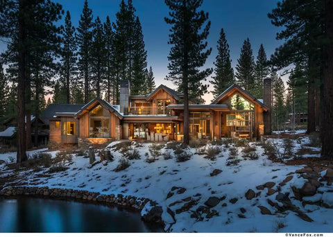 Real Deal Reclaimed Rustic Wood Stain Providing A Hella Smooth Water Based Finish That Reacts Naturally With Tannins To Create An Authentic Weathered Look Perfect For Interior Or Exterior Makeovers In A Convenient 55 Gallon Barrel on a beautiful rustic cabin surrounded by snow and trees.