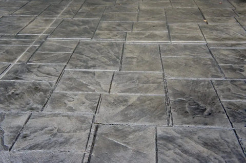 Rock Solid Penetrating Concrete Sealer 5 Gallon Solvent Based Wet Look Finish on stamped concrete surface.