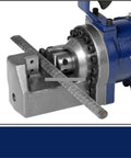 Close-up of Top Tier Cordless Electric Rebar Cutter Boring Machine RC 20 cutting through steel rebar with hydraulic mechanism.