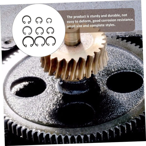 Close-up of 100 Piece Steel Snap Ring Set For Shafts And External Circlips with gears and retaining clips in a mechanical assembly.