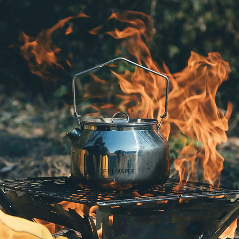 Open Fire Camping Kettle 1.2L Lightweight Stainless Steel Tea Pot for Bushcraft And Outdoor Campfires on a grill over flames