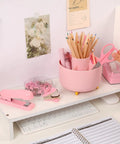 Pink Desk Accessories Set For Home Office 10 Piece Including 360 Degree Rotating Pen Holder Stapler Staple Remover Tape Dispenser Two Tape Refills Scissors Ruler Push Pins Binder Clips Paper Clips Kit on white desk