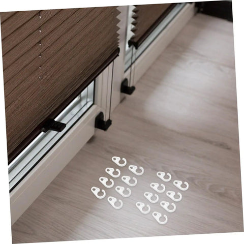 40 Pack Plastic Curtain Hooks for Shower and Window Drapery shown on floor near window blinds