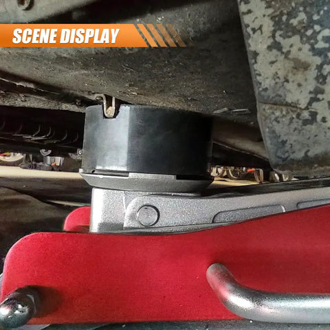 Heavy Duty Rubber Cross Slotted Jack Adapter Puck Pad With Anti Slip Pinch Weld Side Support Block For Universal Car Lifts and Floor Jacks, positioned under vehicle.